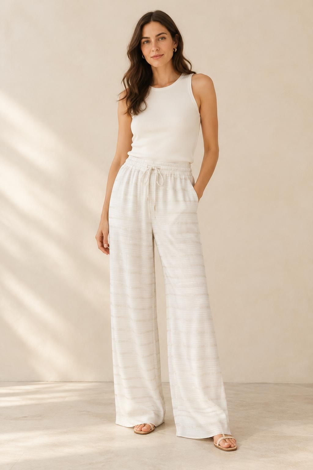 The trousers inspiration using LUREA - Striped satin viscose with lurex fabric