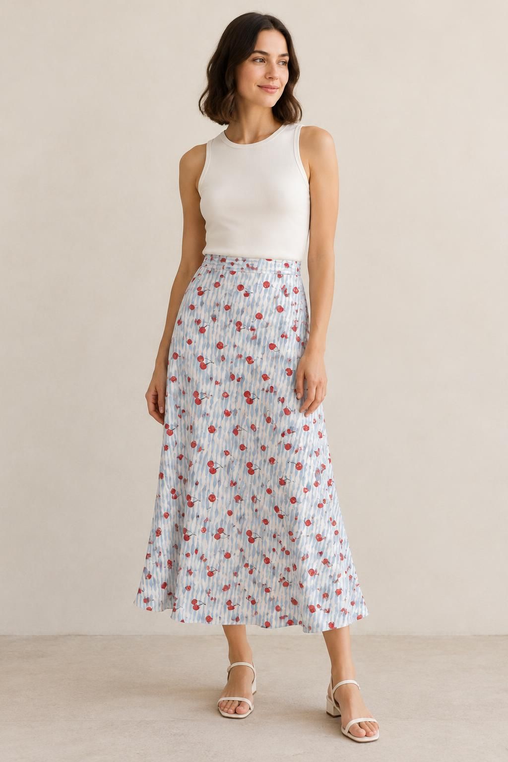 Inspiration La jupe avec le tissu Viscose fluide, cerises rouges et rayures ondulées