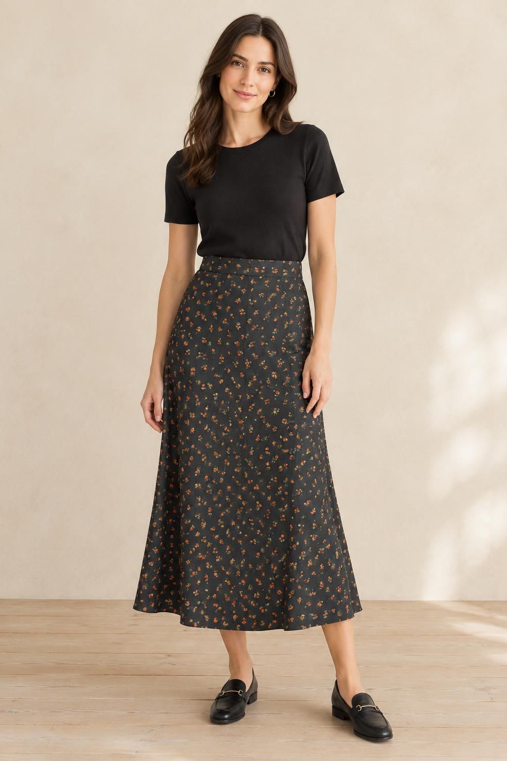Inspiration La jupe avec le tissu Viscose Ecovero, petites fleurs orange sur fond noir